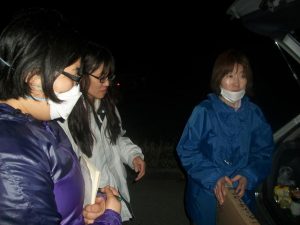 apanese rescuers during night-time meeting